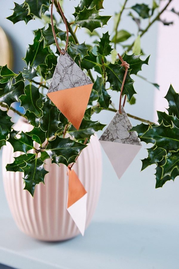 holly plant decorated with diamond shaped pendants